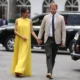 Meghan brings the sunshine! Duchess visits Lagos State Governor's House with Harry in a stunning yellow dress as she honours her Nigerian roots by ditching neutral colours for bright tones - after arriving for day three of 'quasi-royal' tour